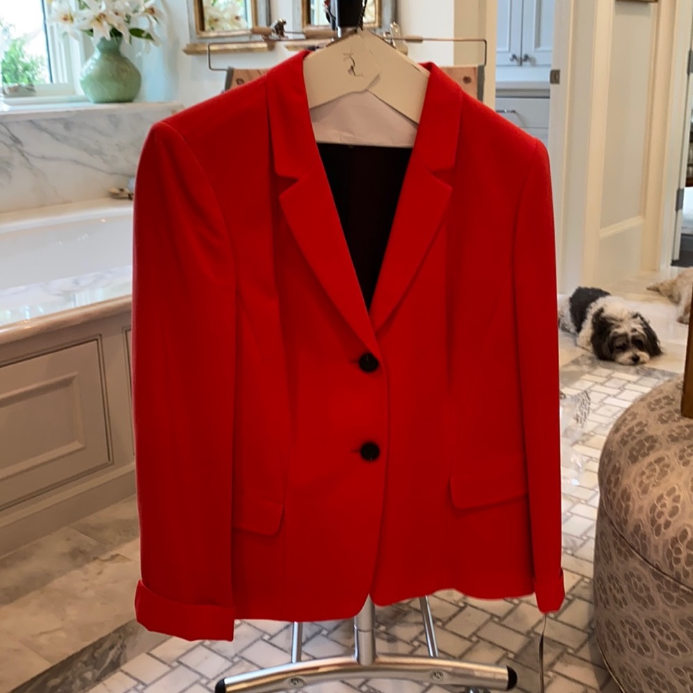Coral red and black women’s blazer.